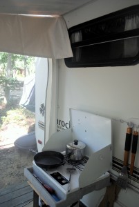 Our main kitchen for the summer. Cooking indoors will never be the same. The kitchen sink was a garden hose.